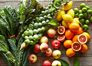 a group of fruits and vegetables on a wood surface Healthy Weight Loss Diets Bridgnorth
