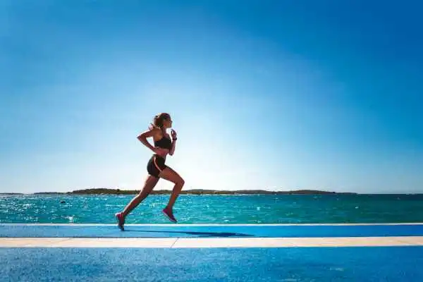 Woman running showing strong leg muscle Bridgnorth